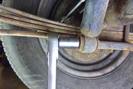 Note: It may be necessary to lift up on the rear axle assembly (using an under