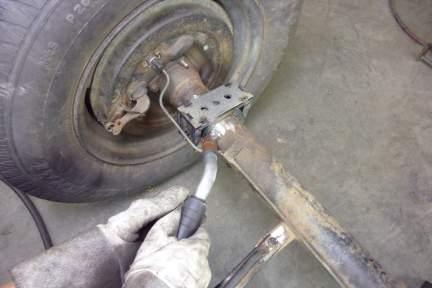 Grind Here Step 143 Using an angle grinder with a Flap Disc or grinding wheel, clean off any rust and/or
