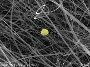 The photo below shows another view of the nanofiber layer, demonstrating the small size of the fibers. For reference, the yellow circle represents a 10 micron size particle.