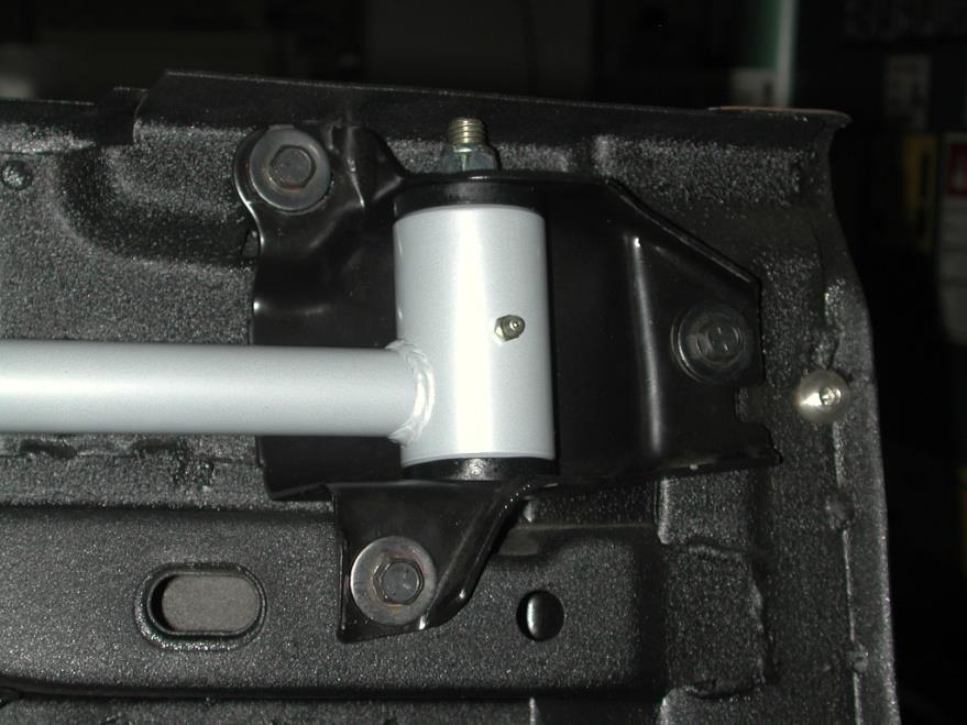A backer plate is supplied to be installed inside the trunk. 5. Install the large end of the lower bar (the long one) into the factory spring mount using the factory hardware.