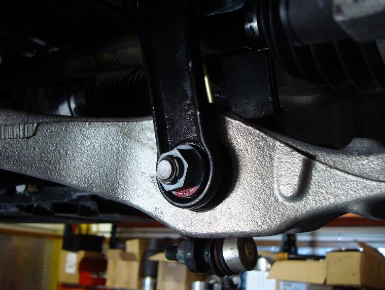 6. REMOVE THE LOWER SHOCK MOUNTING NUT