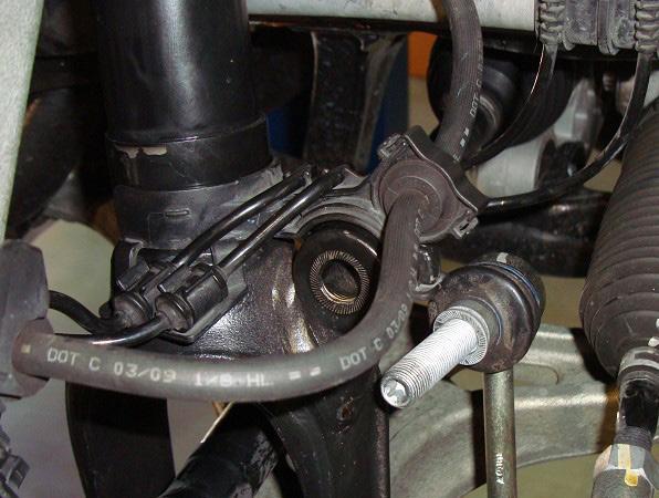 REMOVE THE BALL JOINT NUT AND SEPARATE