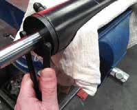 step 2 (2" rams) Using an adjustable pin spanner, unscrew the seal