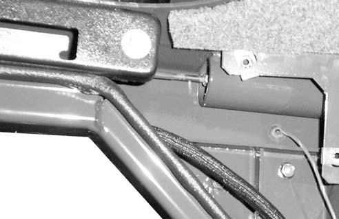 2 Shut off the engine and engage the parking brake. 3 Measure the distance the boom support pins are protruding past the inner boom arm plate.