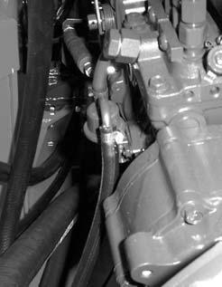 C4683) 3 Loosen the fuel line clamp and disconnect the fuel line from the engine. (fig.