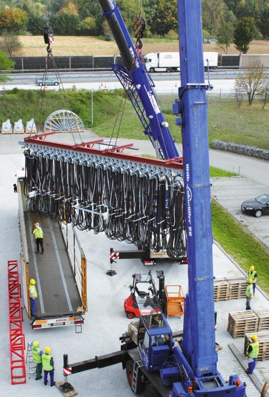 factors Pre-assembly - Mounting the cable trolleys on the transport beam - Laying out and aligning the cables - Installing the equipment - Loading and transporting the festoon system to its site of