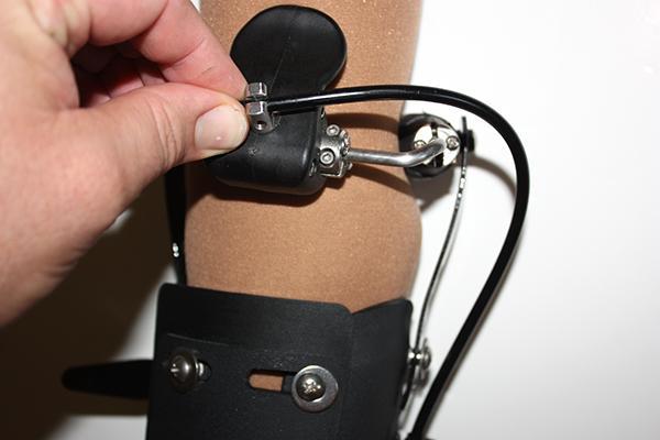 Step 28: To install the cable into the cuff swivel, remove the black cap and its retaining screw from