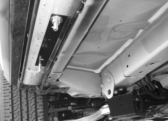 loosen the Brackets and drop them down slightly to fit the Running Board between the vehicle and the Brackets.