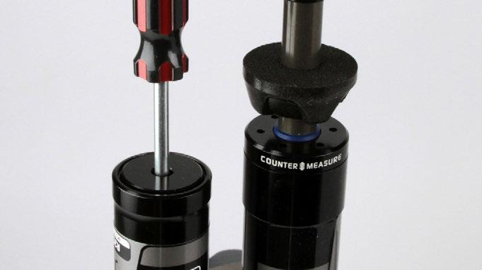 If the Schrader valve does not move at all, the shock is still pressurized and will need to be sent to an authorized RockShox service