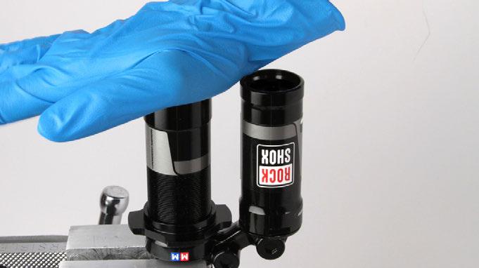 8 Pour RockShox 3wt suspension fluid into the damper body until it is level with the top of the damper