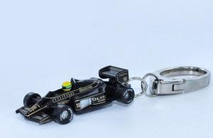 The keyring on the left represents the 1985 Lotus 97T as driven by Ayrton Senna.
