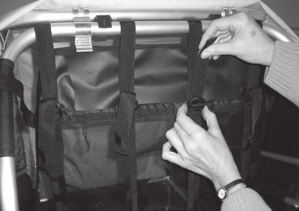 Using Adjustable Seat (Encore) Loosen tension on upper strap behind seat.