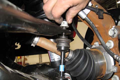 Remove the front caliper and bracket assembly from the front knuckle by removing the (2) retaining bolts.