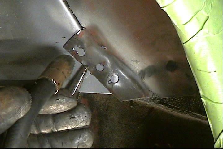 16. Bend the outer wheel tub overlap flat against the Detroit Speed Mini Tub