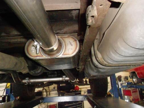 mount. The red exhaust mount should hang straight up and down. Repeat this step on the left side of the vehicle with tailpipe #86354. 5) Place a supplied 2.