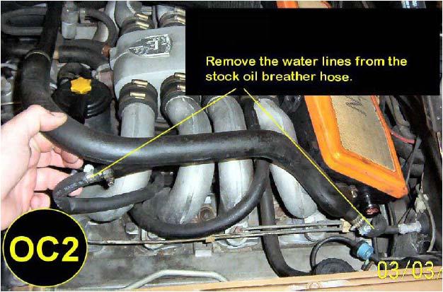 First, disconnect the stock oil breather hose in the two places as shown in picture OC1.