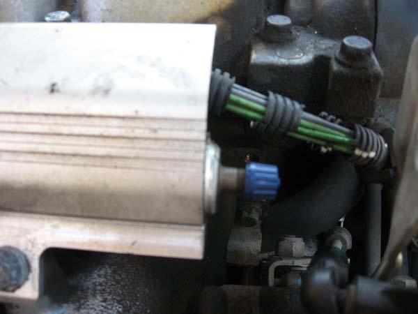 Schrader valve at fuel rail At this point, you can unbolt the fuel rail (I believe it was a 17mm open-end wrench, but an