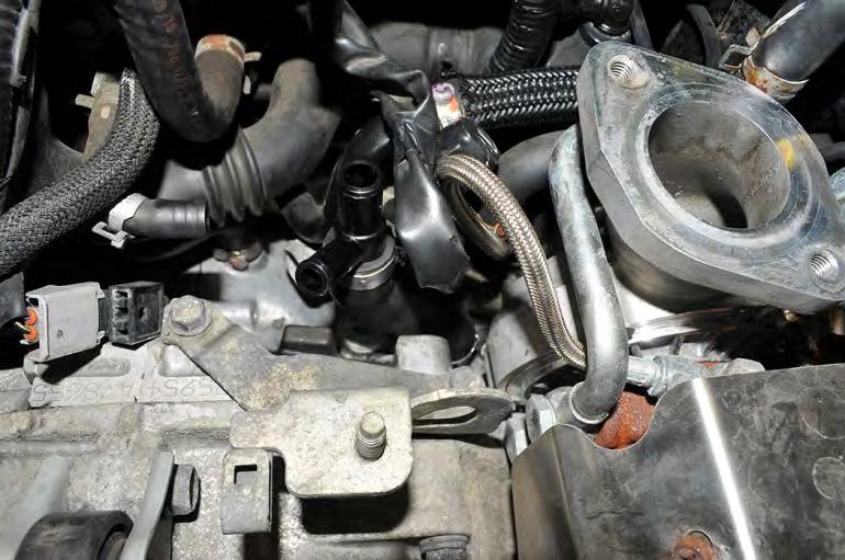 14.a Late Models: Remove the clamp from the remaining blow-by sensor hose at the turbocharger inlet.