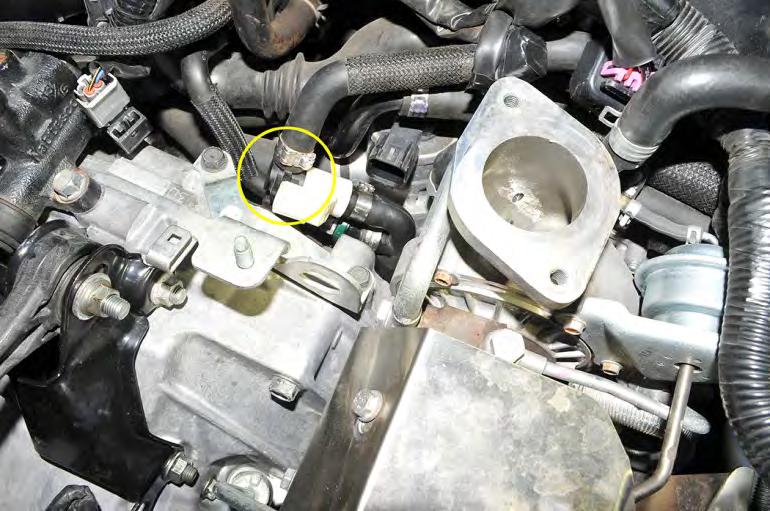 Remove the hose from the sensor by pulling the black plug out from the white housing.