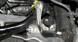 61. Remove the lower nut from the endlink by placing a 6mm wrench on the end of the
