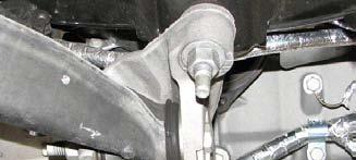 Loosen the rear engine cradle nuts with a 21mm deep socket and lower them