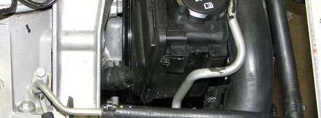 114. Use a 15mm wrench to remove two bolts retaining the power steering reservoir bracket.