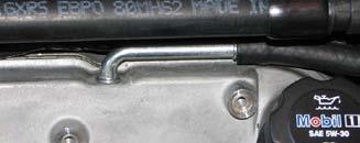 Install the supplied fuel line from the firewall fitting to the U-shaped fitting on the driver side fuel rail. 169.