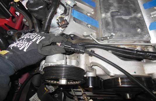 Use a 15 mm wrench to remove the EVAP Solenoid mounting bracket from the right hand side, front of the