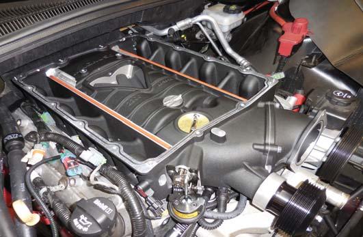 Ensure that the gasket on top of the supercharger assembly is properly seated, place a small fi