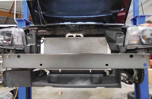 248. Mount the front bumper impact bar with the 6 OEM bolts using a 12 mm socket. Torque these bolts to 22 ft-lbs.