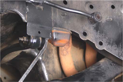 11. Raise the lower control arm and insert the factory bolt in the axle end. Hand tighten.