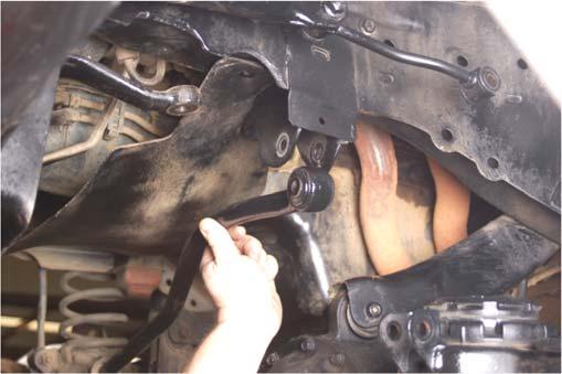16. Remove the track bar using a 19mm wrench/socket from the driver side mount. See Photo 11. 17.