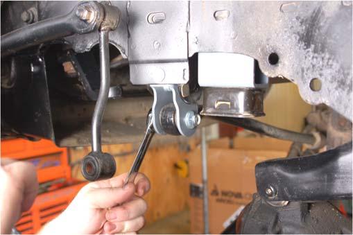 23. Install the new front coil spring using a coil spring compressor. On lower surface make sure coil end is rotated to stop and on upper mount re-use stock rubber coil isolator. 24.