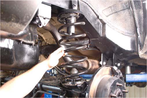 Reinstall the e-brake and brake line on the upper control arm and tighten using a 10mm wrench. Photo 7 Photo 8 Install Upper Sway Bar Drop Bracket Install the New Coil Spring 13.