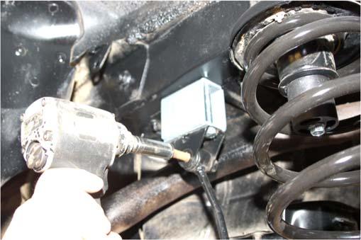 Install the bushing and sleeves in rear shocks a liquid soap may ease installation of bushing into shock eye.