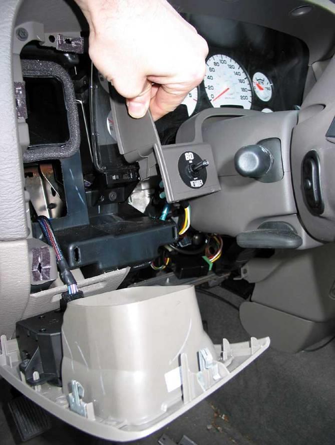 15 Install the switch into the drilled hole and secure it with the plastic lock ring. Reinstall the dash trim panels by reversing the removal procedure.