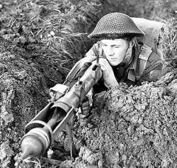 armed with a Boyes Rifle at Milne Bay 1942.