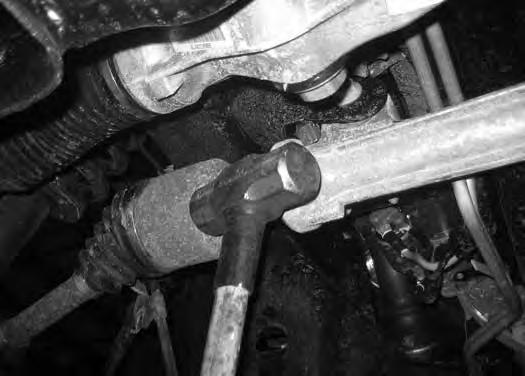 22. Remove the passenger's side CV shaft. Strike the shaft with a hammer to dislodge it from the splines.
