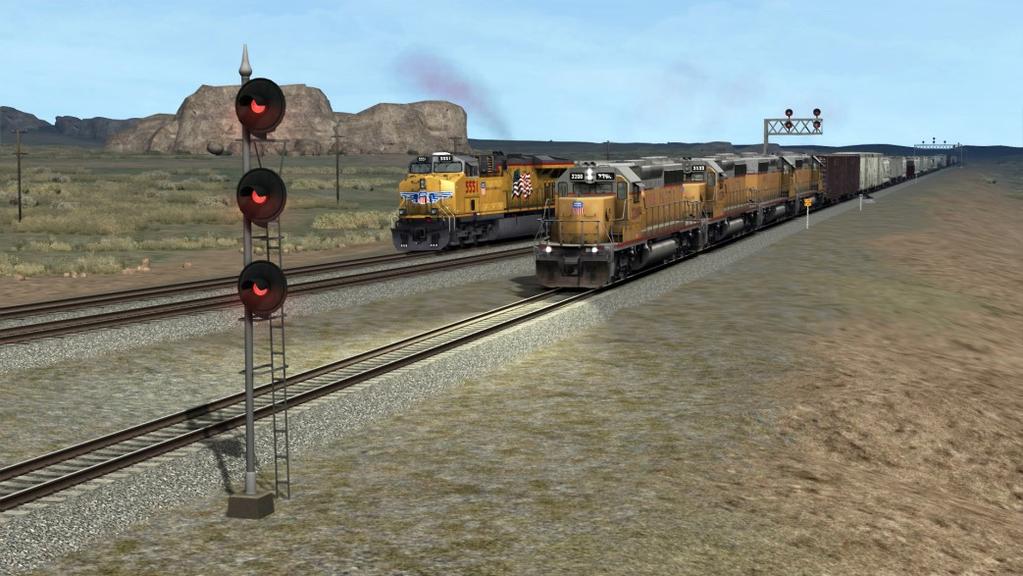 quartet of veteran UP EMD SD40-2 diesels as power. Having coming up the Denver line via Greeley, you are stopped at Speer, Wyoming, awaiting westbound clearance onto the Laramie Subdivision's Track 3.