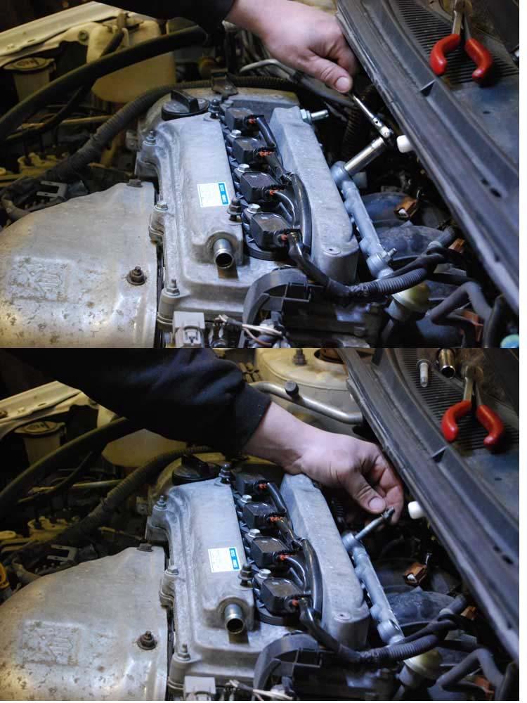24. Pull up on the fuel rail to dislodge the injectors from their lower seals.