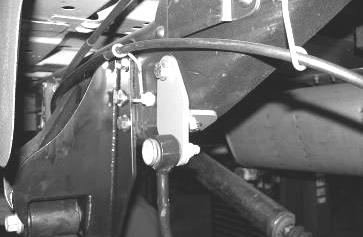 Using the supplied 3/8 x 2 bolt, nut and washer, attach the brake line to the other end of the bracket. Reattach vent line. SEE FIGURE 5 8.