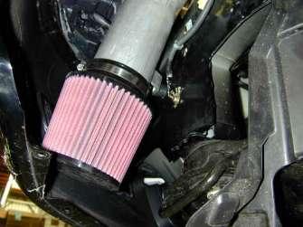 f. Install the silicone coupler over the throttle body and hose clamps but do