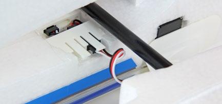 5. Offer the right-hand wing panel to the fuselage, plug the aileron servo