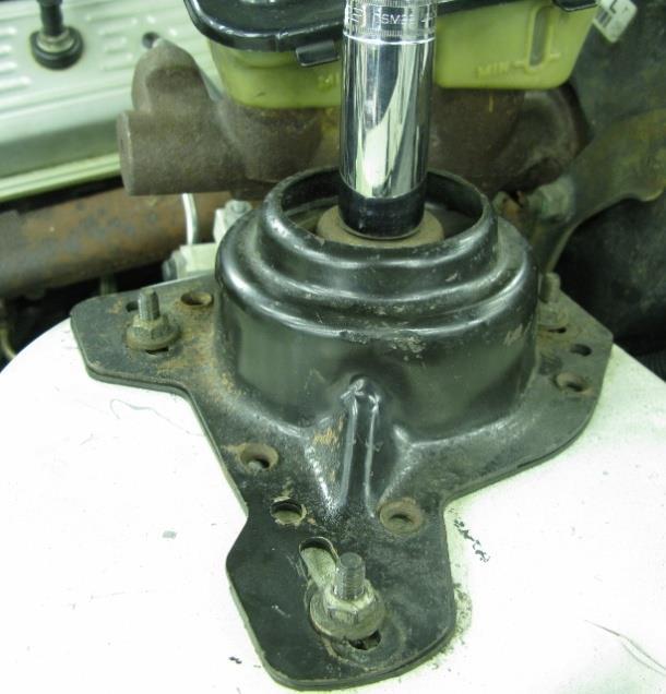 4. Remove the cover from the upper mount assembly to gain access to the upper strut mount.