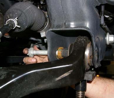 5 ) Remove the two lower control arm mounting bolts.