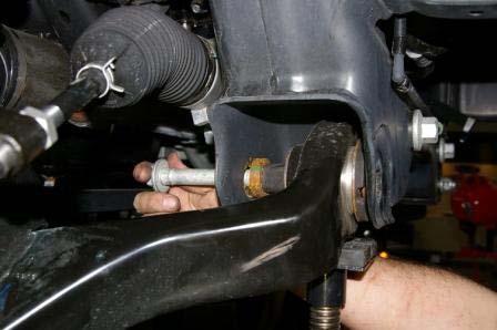 9) Install the two lower control arm bolts but do not tighten. 10) Tighten the upper ball joint.