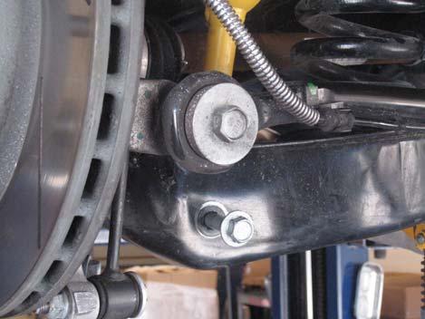 1. Loosen and remove the two bolts that secure the rear exhaust