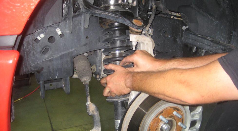 6. Remove the 2 bolts that connect the lower control arm to