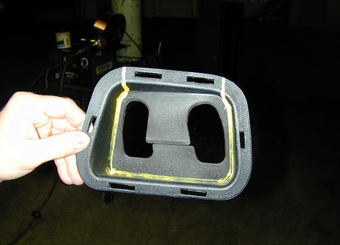 Reattach the rubber tow hook inserts, using a silicone adhesive along the side alignment tabs (Fig.W). 18. Reattach the passenger side lower fascia reinforcement, which you removed in step 1. 19.