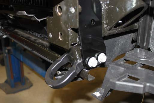 14. Models w/ Tow Hooks: Align the baseplate with the tow hook holes. Loosely install the tow hook and existing hardware.
